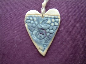 Heart pendant blue closeup